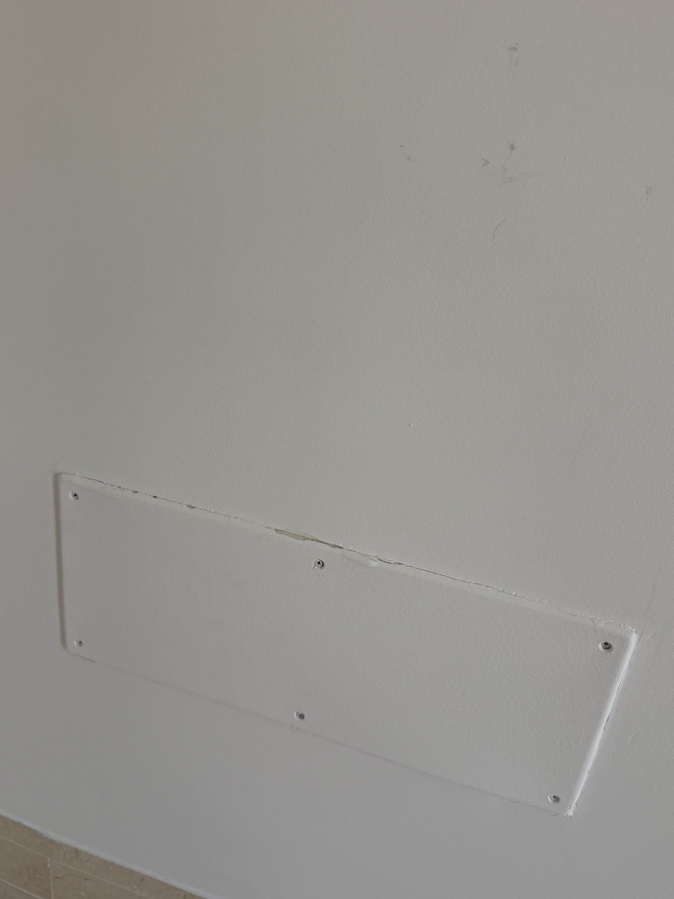Open module and visible wiring beside a socket.